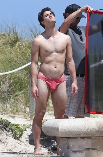 Darren Criss in his swim trunks in a scene from American Crime Story: Versace